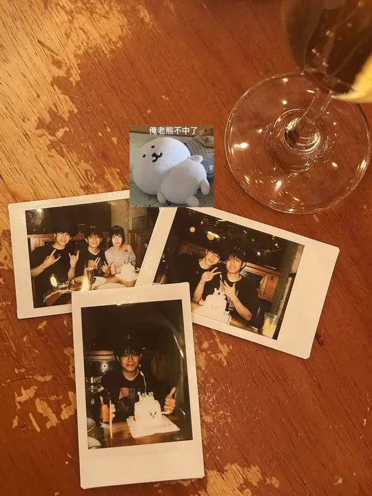 Instant photos with friends on a wooden table