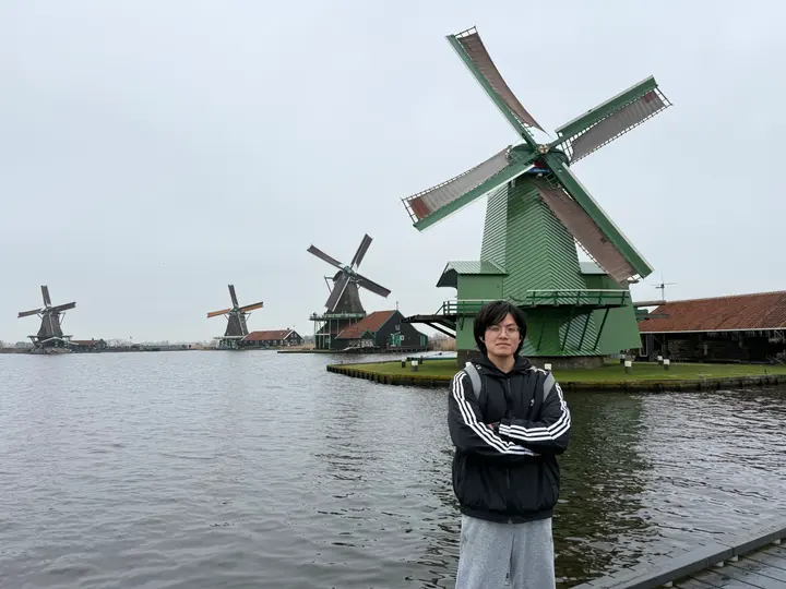 YU Jiachen in front of Dutch windmills